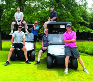 Dave, Michelle and Andrew MacKinnon with friends at their annual Golf Tournament